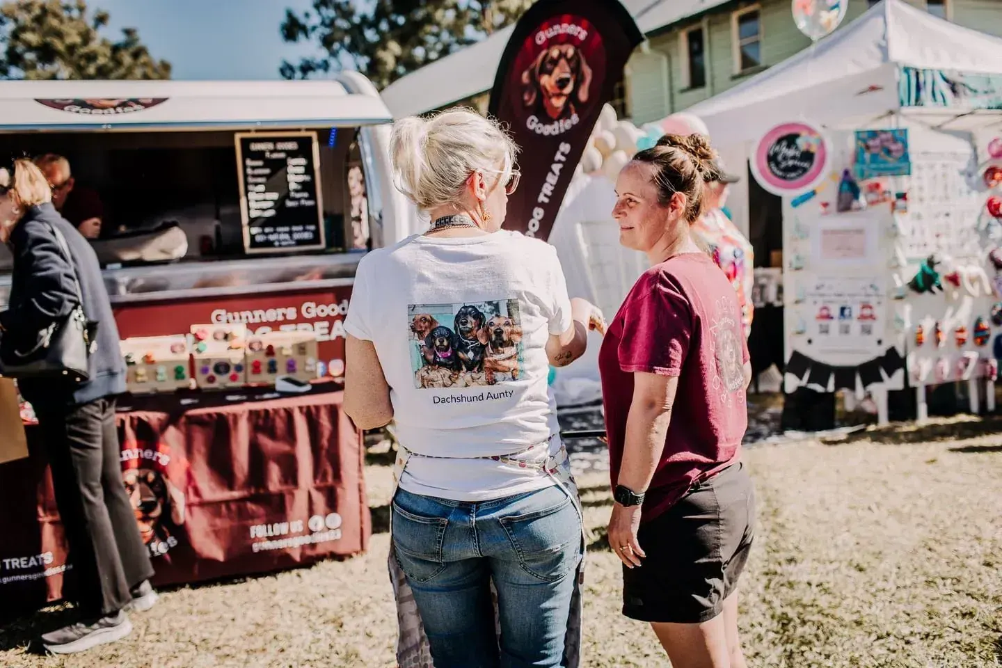 Dog owners chatting at the Gunners Goodies stall